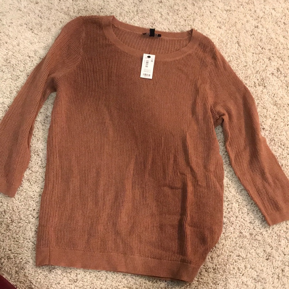 The limited sweater size medium